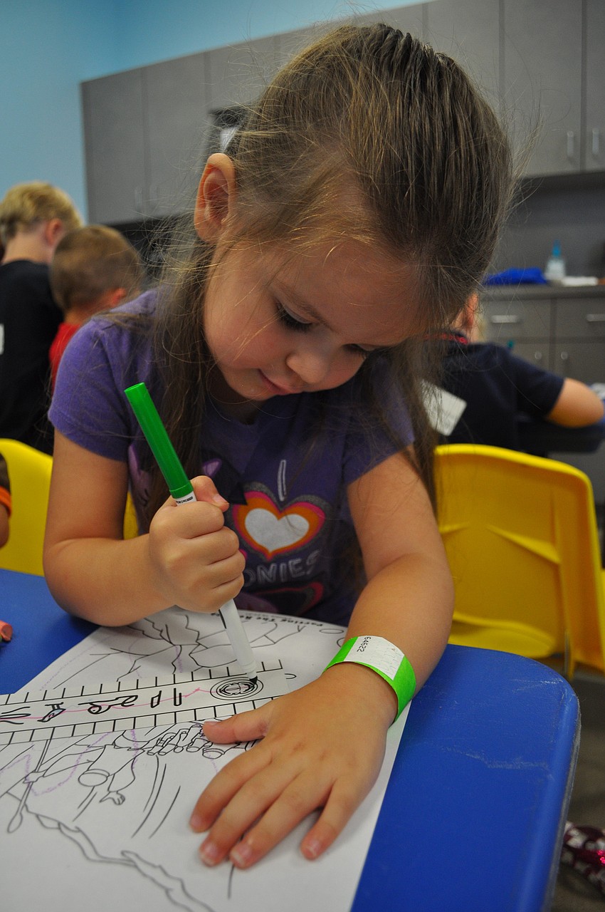 Kassidy Callaghan, 3, intently worked on her coloring during.