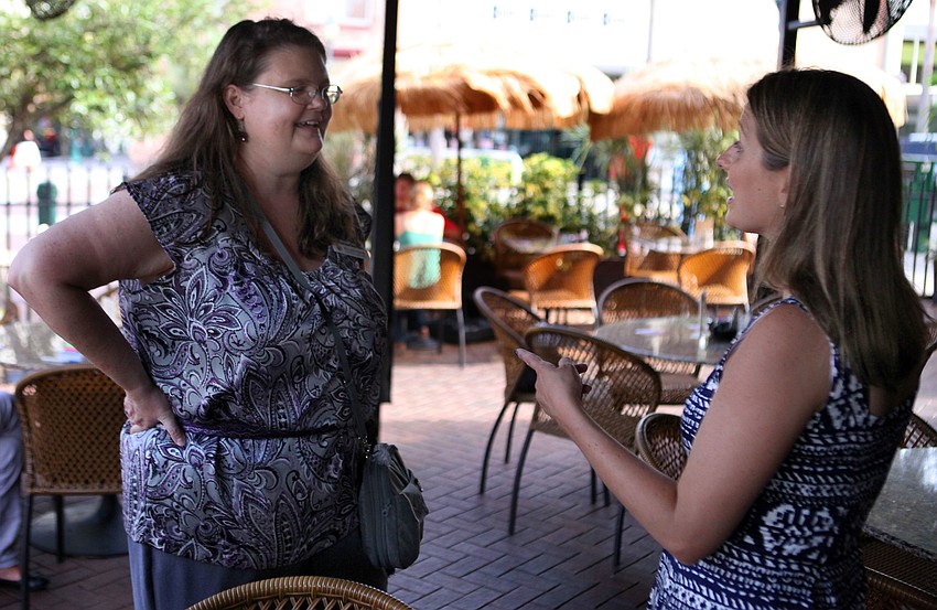 Christina Gordon and Vivian Owen chat with one another, Tuesday, July 31.