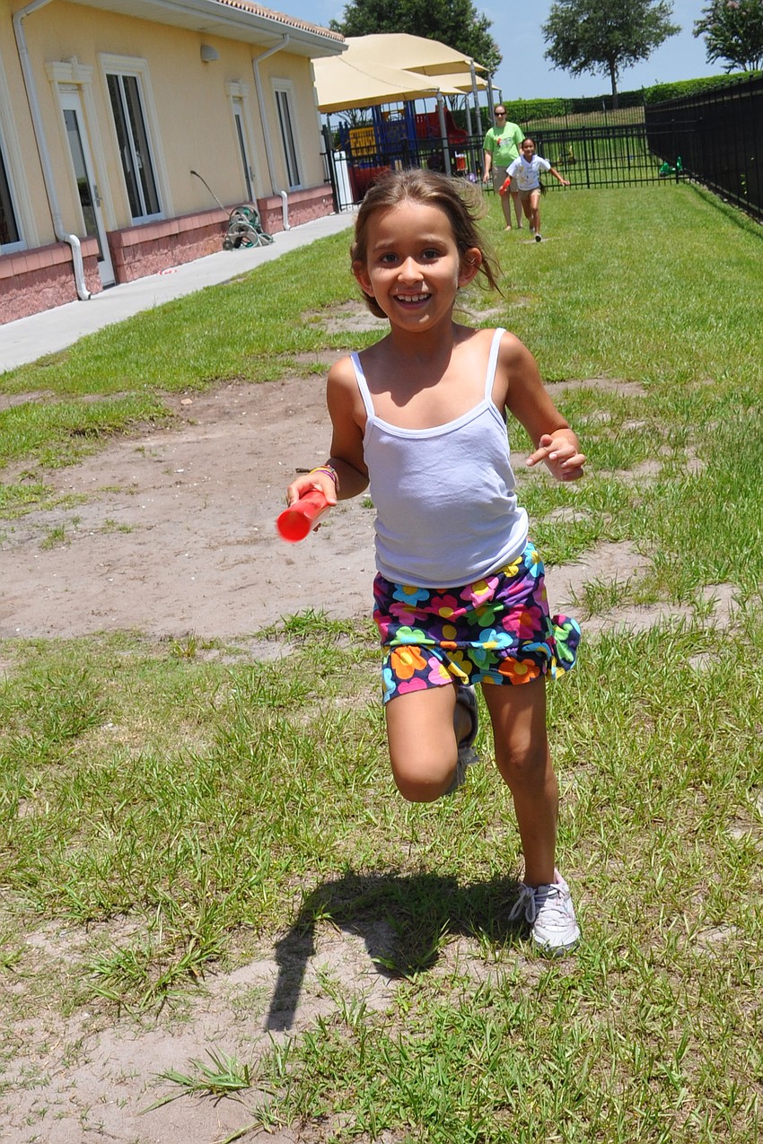 Sophia Aguayo, 7, passed the baton like a professional during the relay event.