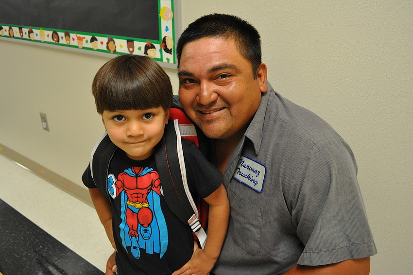 Alejandro Pina, 4, was dropped off for pre-kindergarten classes by his dad, Joe, and 8-year-old brother, Emilio, not pictured.