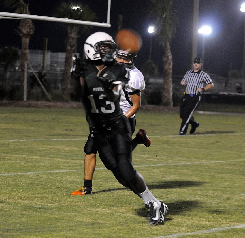 Mustangs wide receiver Terez Davis goes up for a pass late in the first half.
