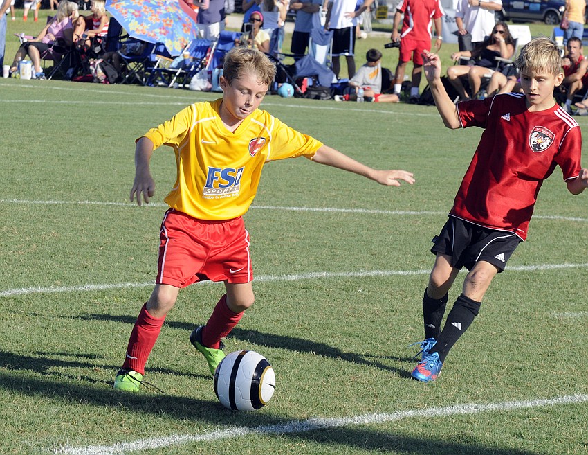 Nine-year-old Zeke Williams scored a goal for the Clearwater Chargers U10 boys team in its opening game against FC America.