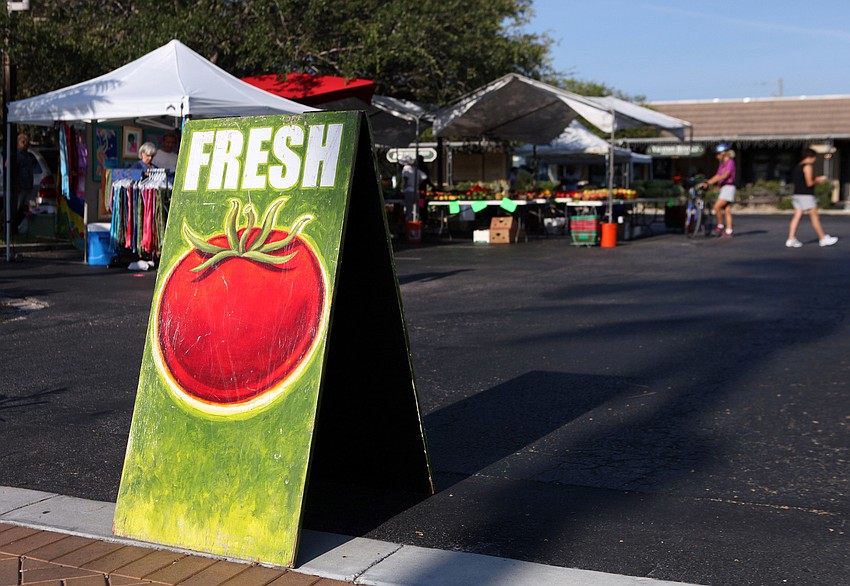 A hand-painted sign with a tomato and the word â€œfreshâ€ was on display Sunday, Sept. 1 at the Siesta Key Farmers Market.