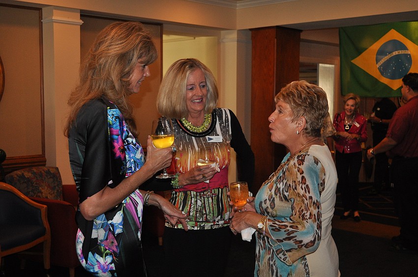 Rene Brooks, Annette Lloyd and Sue Hanes chat with one another Saturday, Sept. 8.