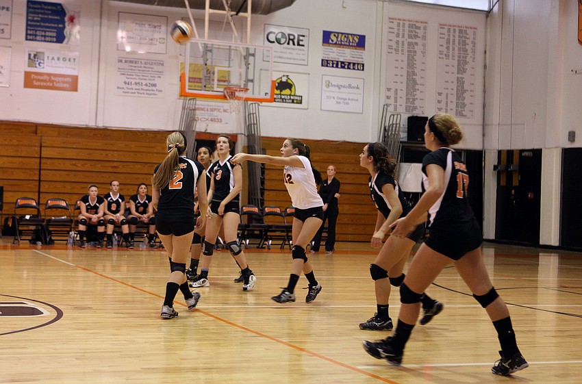 Jordan Brooks, No. 12, goes to bump the ball back over the net during Sarasota High Schoolâ€™s game against Cardinal Mooney Tuesday, Sept. 11.