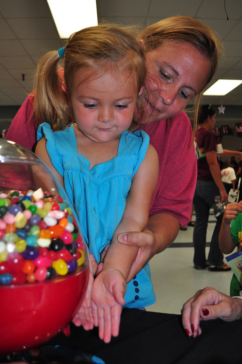 With the help of her mom, Kristin, 3-year-old Merina Earle practiced estimating with jelly beans.