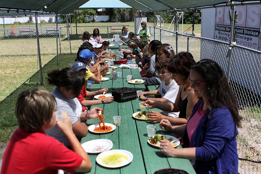 NewGate School students and faculty eat lunch with their guests from LÃ©on, Mexico.