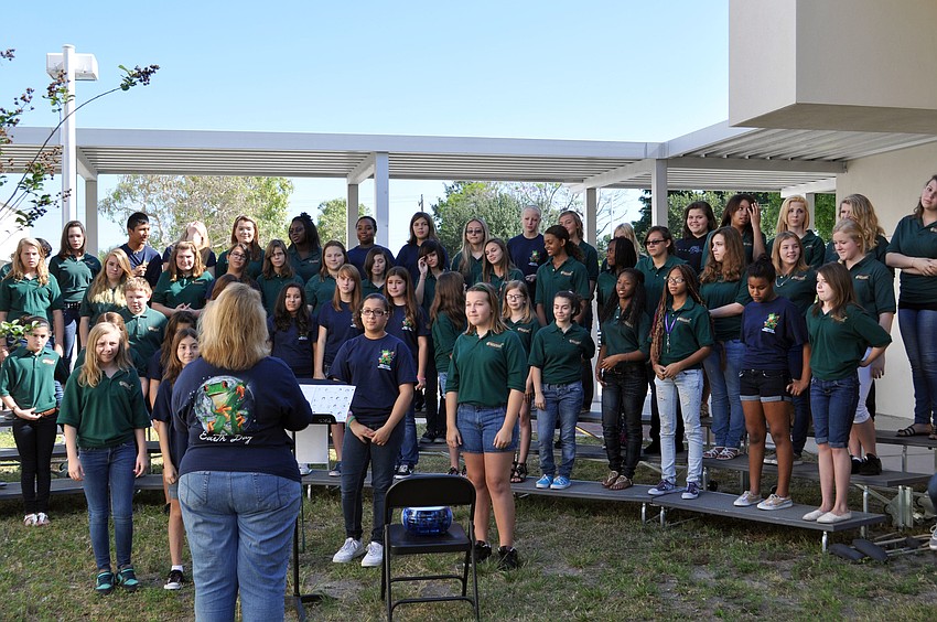 Students sing Earth-day themed songs.