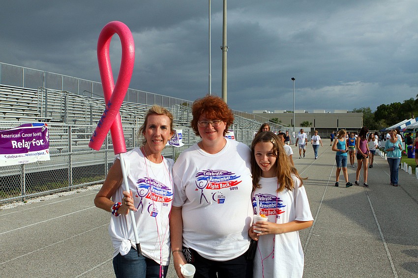 Deborah Gibson with Lisa Coddington and her daughter, Rhiannon, 11, walk the track for T.J. Maxx.