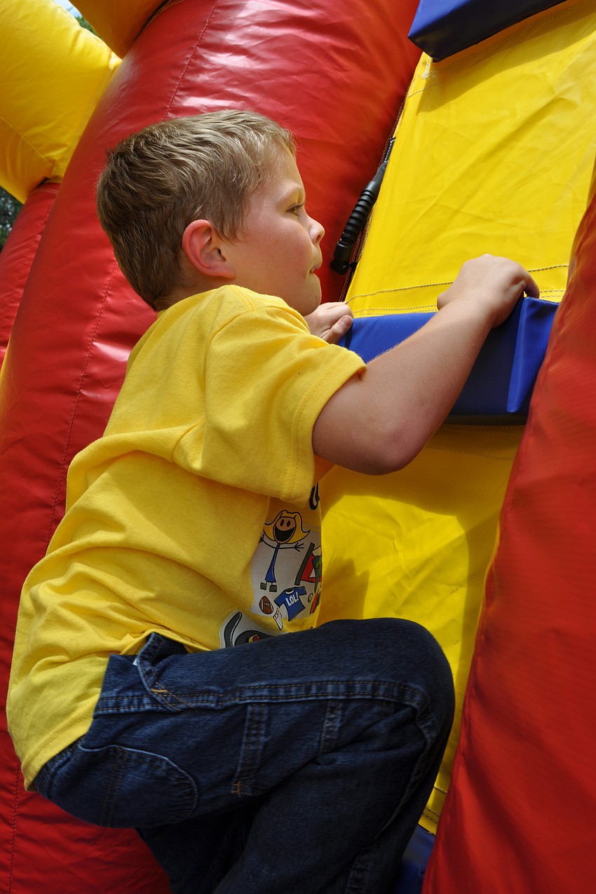Solomon Martin, 6, climbed the wall of the obstacle course in no time.