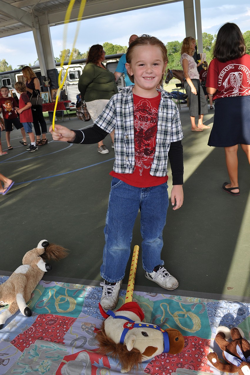 Aidan Edstrom practices with a lasso.