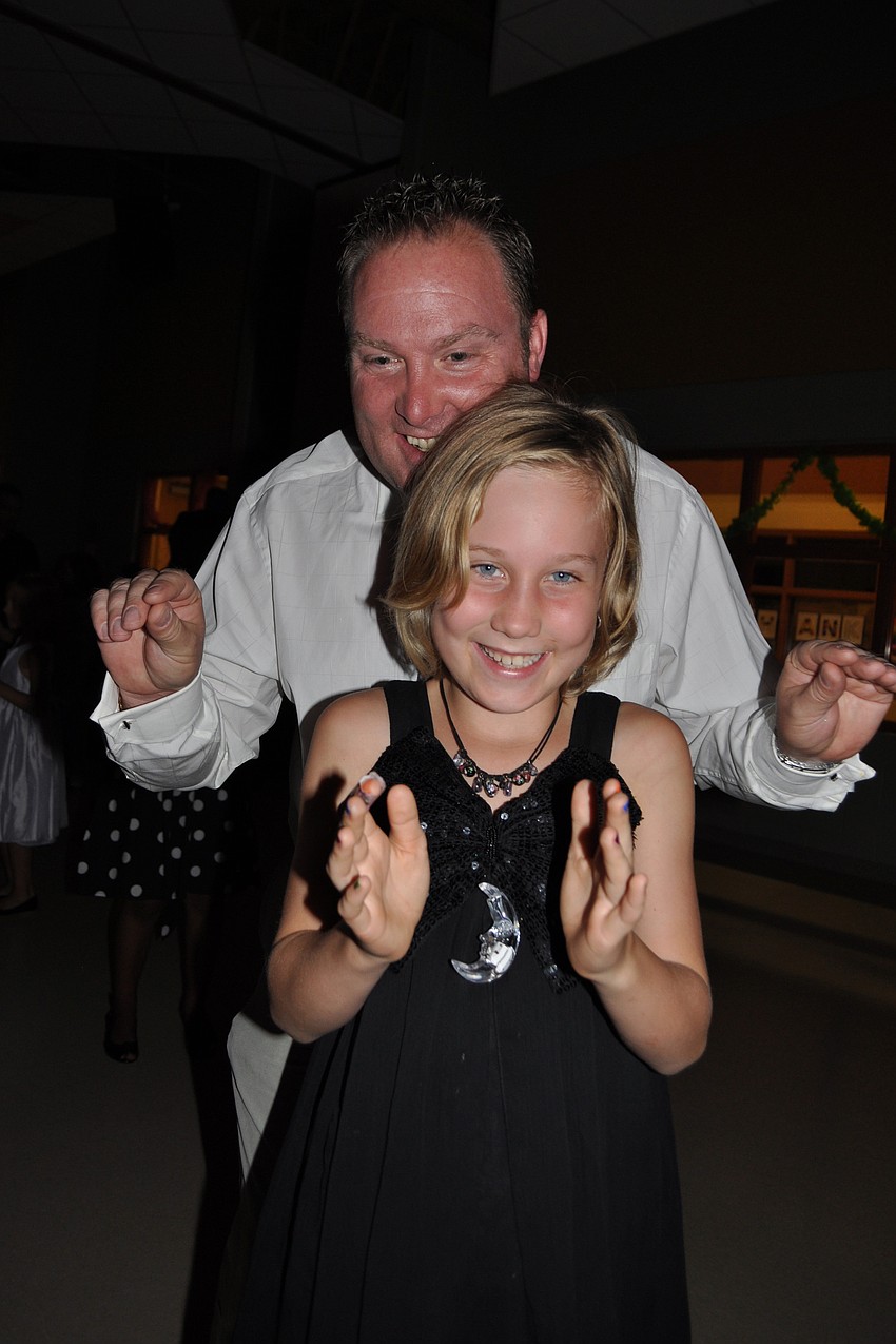 Gareth and Kelsey Davies dance together.