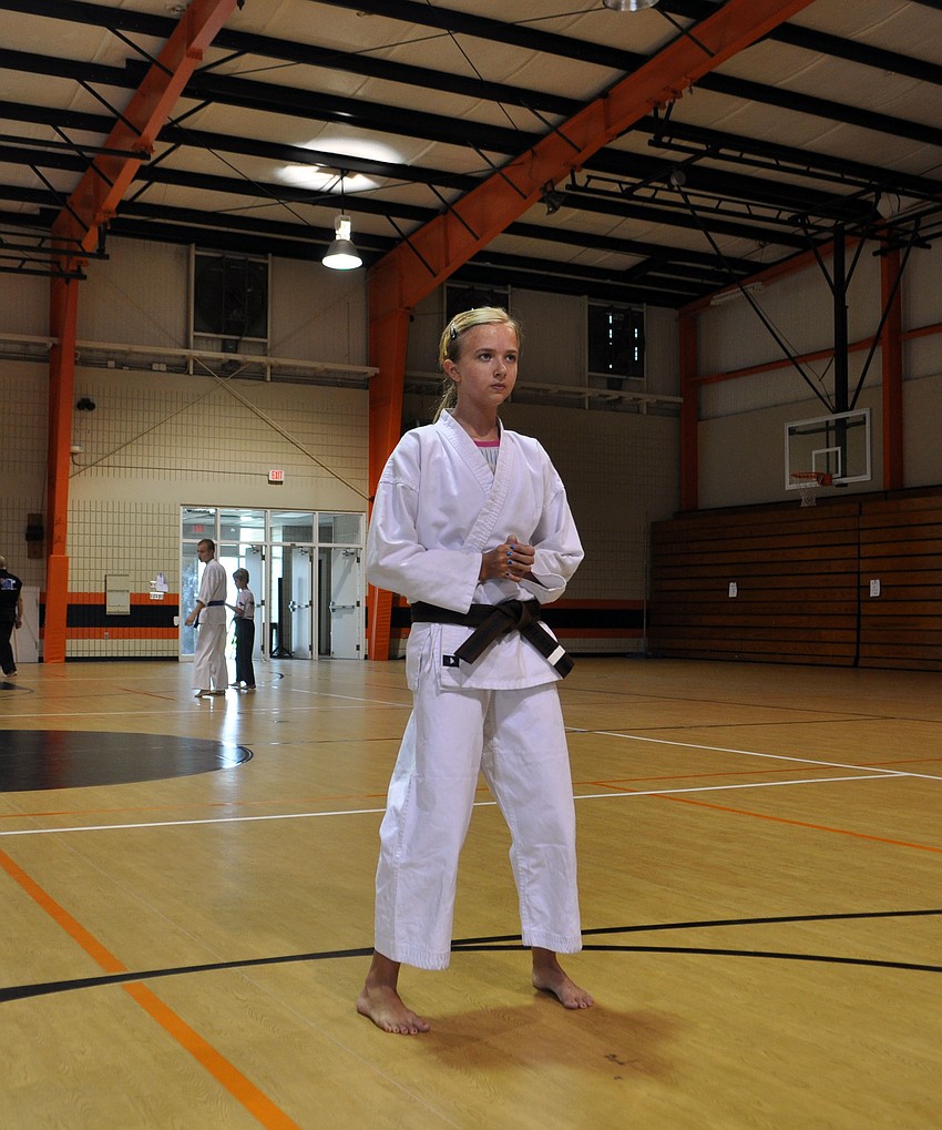 Sarah Hosford practices her kata, which is a series of choreographed martial arts techniques.