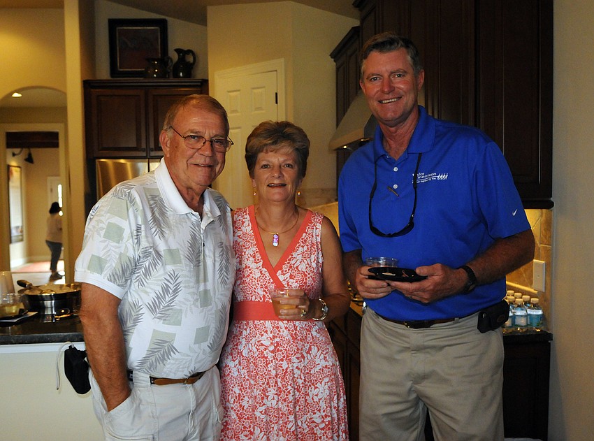 John Wiginton and his wife Gwyneth Paget, pictured with Taylor Morrison senior builder Fred Kunkle, bought a home in Esplanade.