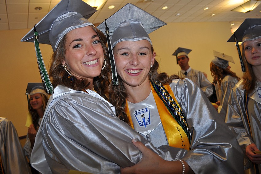 Nicole Himmler gives a hug to her friend and fellow Lakewood Ranch High graduate Taylor Halligan.