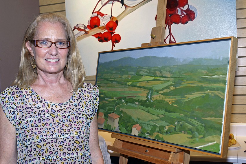 Artist and Let's Create Art instructor Lucy Barber displayed an oil landscape painting.