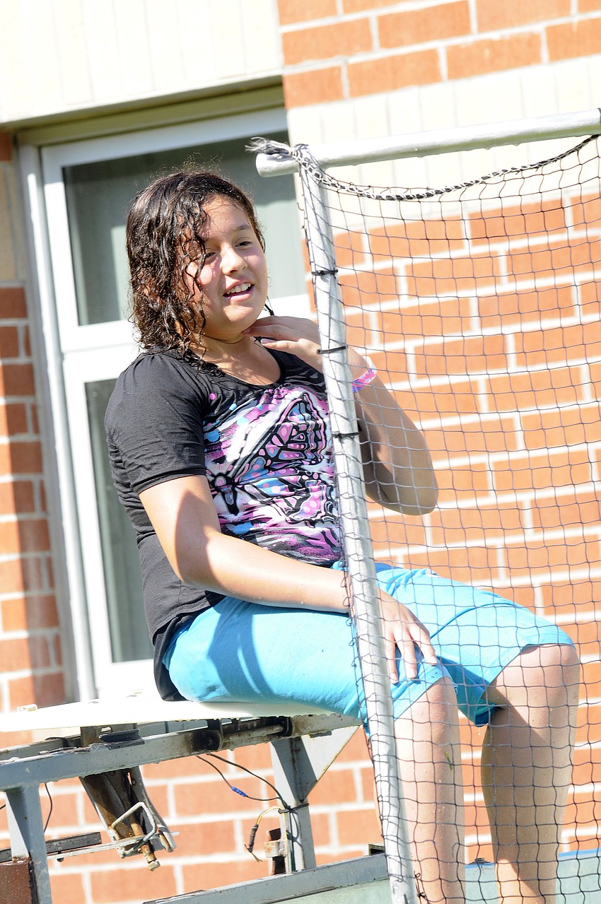 Laura Acosta, 11, was one of several fifth-graders to try out the dunk tank.