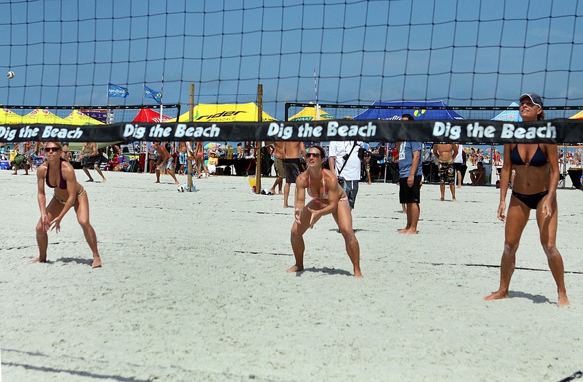Dena Dahlquist, Abbey Beasley and Dawn Meyer stand ready to receive the serve from the other team.