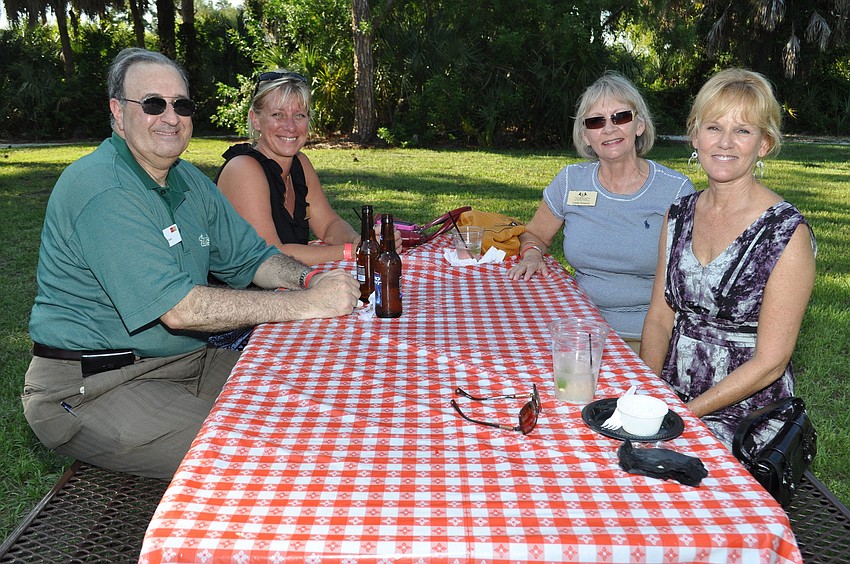 Jim Perrone, with WellsFargo; Charmian Miller, with The Florida Center; Linda Greaves, with The Florida Center; and Michelle Shad, with Athlein