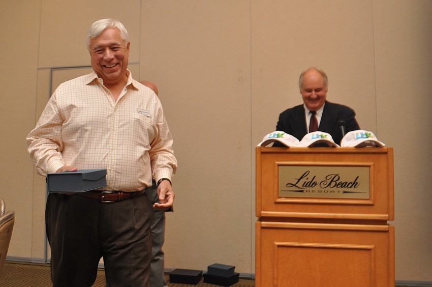 Rookie runner up Brian McCarthy accepts a certificate from President Tom Aposporos