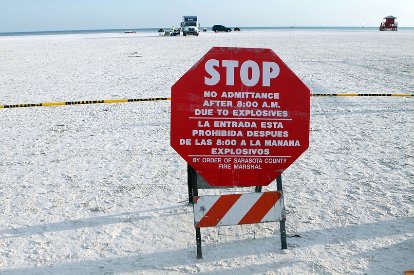 Caution tape and large red signs were put up around the perimiter of the beach where the fireworks were to be set off, Wednesday, July 4, on Siesta Key Public Beach.
