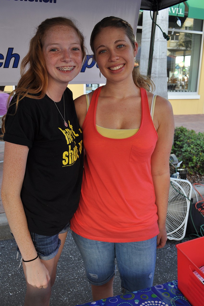 Makayla Bates and Megan Chaplin, of Sarasota Baptist, did a craft with children.