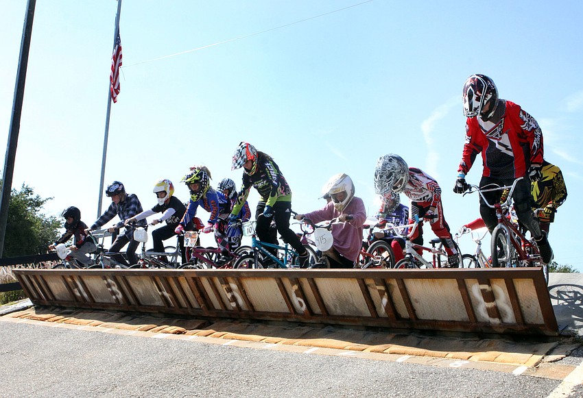 Racers prepare to go down the first big hill of the course at Sarasota BMX, Saturday, July 7.