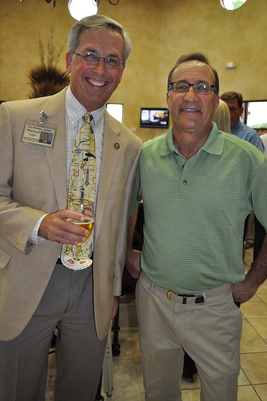 Michael Vejins, of Raymond James, with Bill Kalter, of H&K Graphics