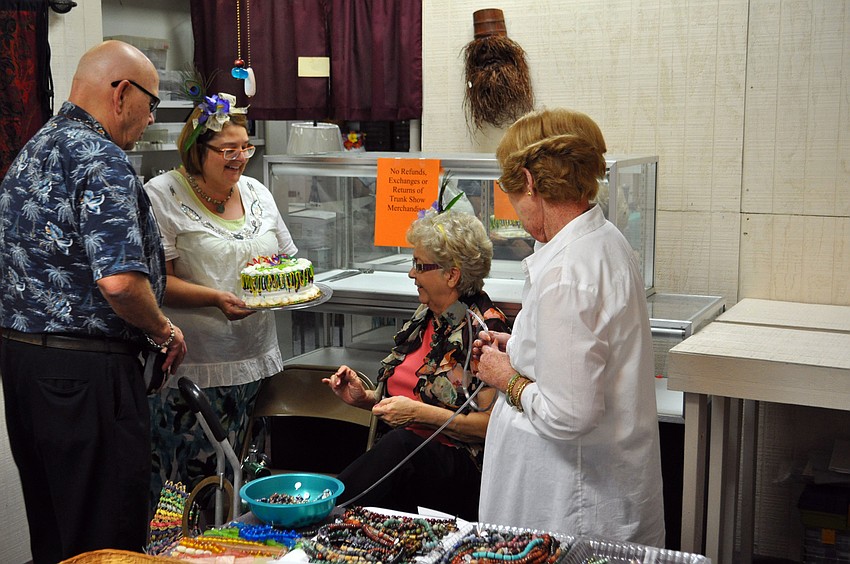 Karen Johnson presents Marty Montague with a celebratory cake.