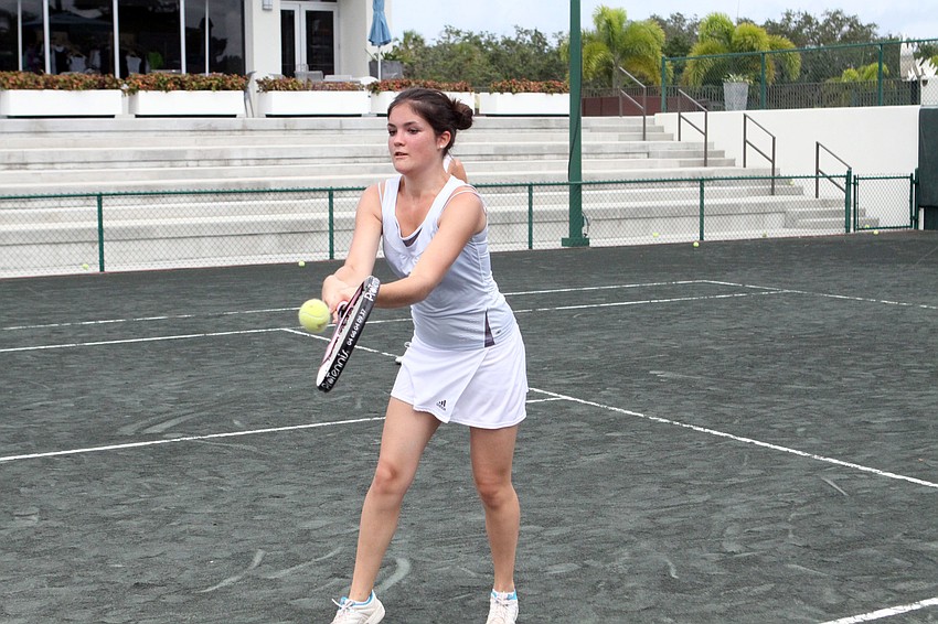 Jeanne Miller, 15, goes to hit a backhanded volley, Tuesday, July 24, at the Tennis Gardens.