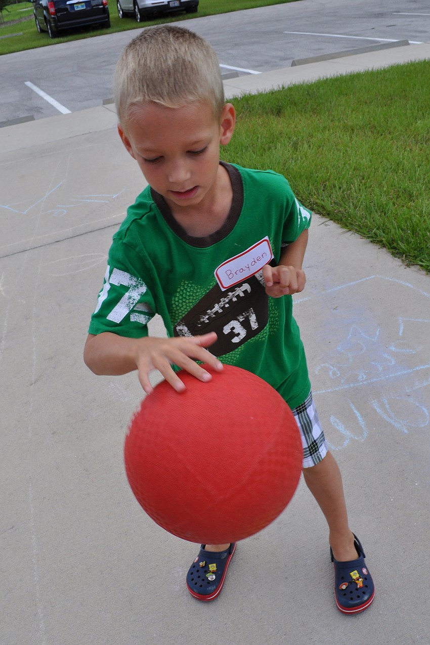 Brayden Sullivan, 6, dribbled the ball 10 times before advancing to the next part of the obstacle course.