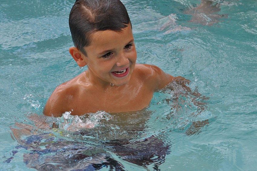 Colin Cardinal had fun being thrown into the water by a camp counselor.