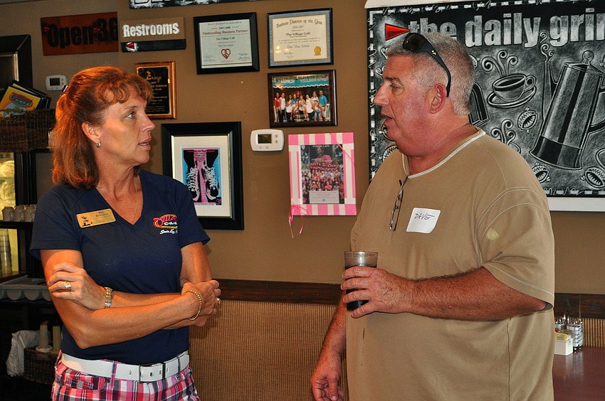 Kay Kouvatsos chats with Dave Macgee, Thursday, Aug. 16, at the SKCC After Hours event at the Village CafÃ©.