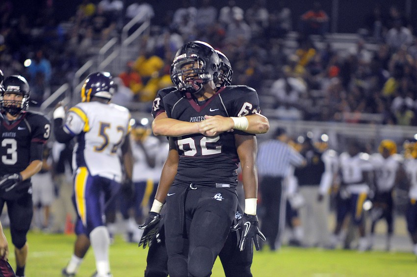 Senior Kelvin Albritton is congratulated following his third fumble recovery of the game.