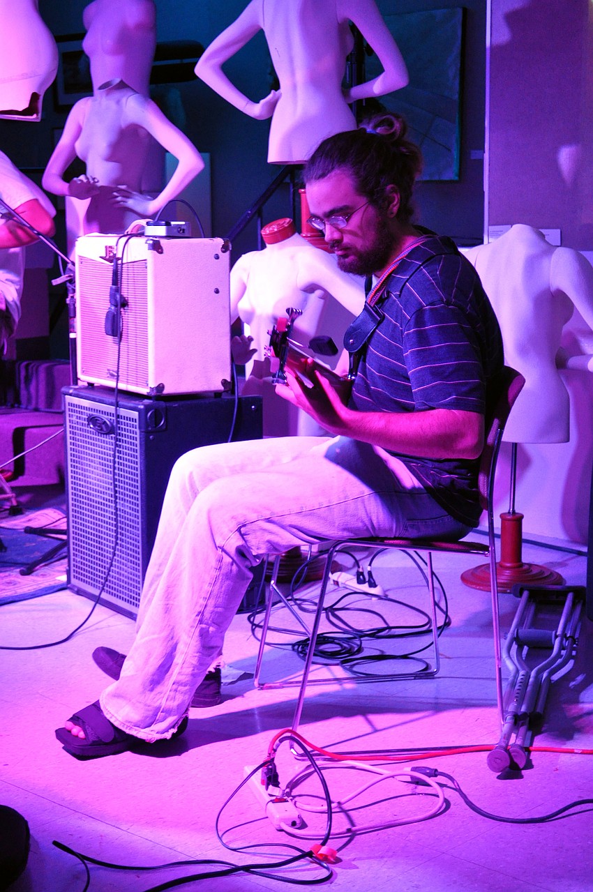 Dave Baker plays bass during Physical Plantâ€™s set.