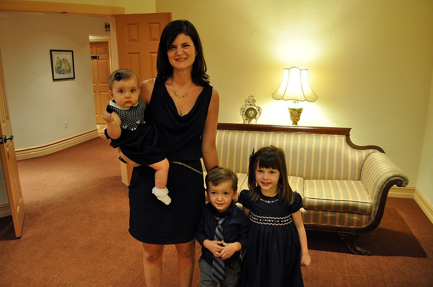 Hannah Toale stands with her children, Laurel, Hudson and Claire.