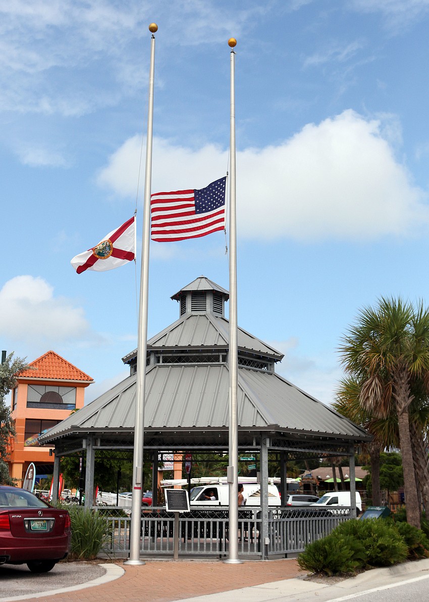 The American flag and State of Florida flag were both at half-mast Tuesday, Sept. 11 by the gazebo in Siesta Key Village.