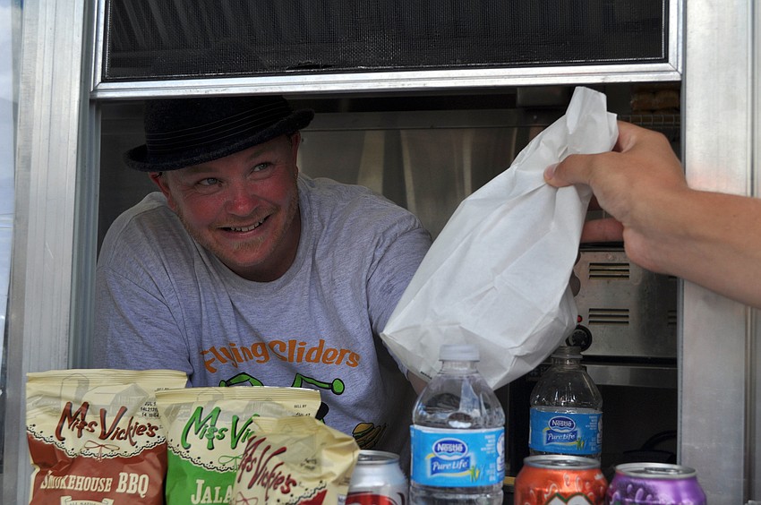 Andrew Seeley of Flying Sliders serves up an order Tuesday, Sept. 11.