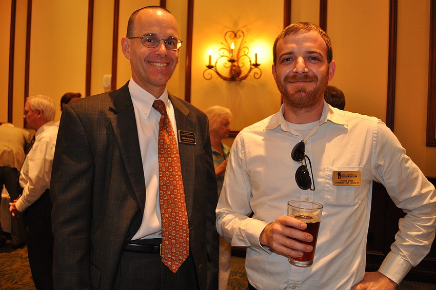 Clifford King,  of Dunlap & Morgan, with Patrick Myers, of Grimefighters Carpet Cleaning