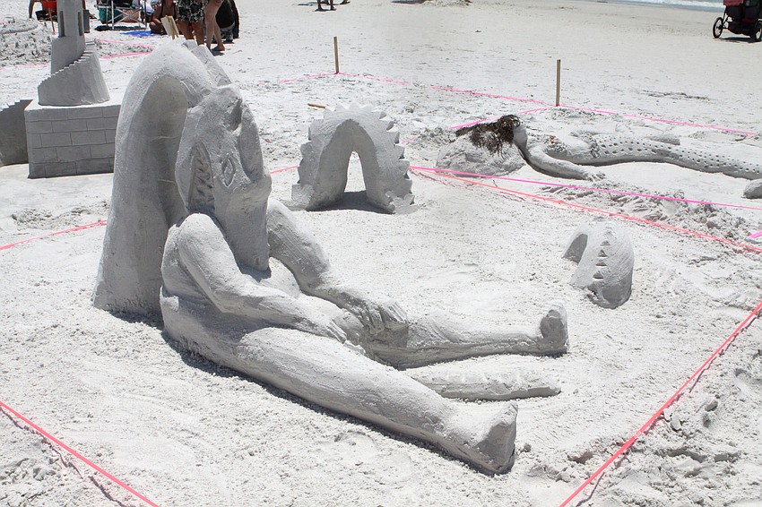 This sculpture had a dragon eating a person lounging on the beach.