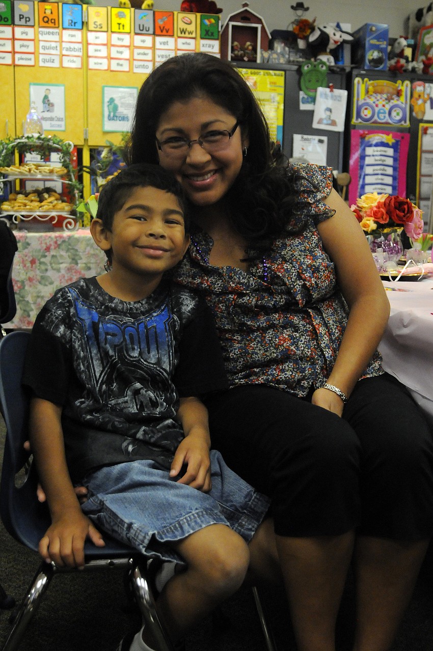 Six-year-old Thomas Garcia enjoyed showing his mom Brenda the different gifts that he made for her.