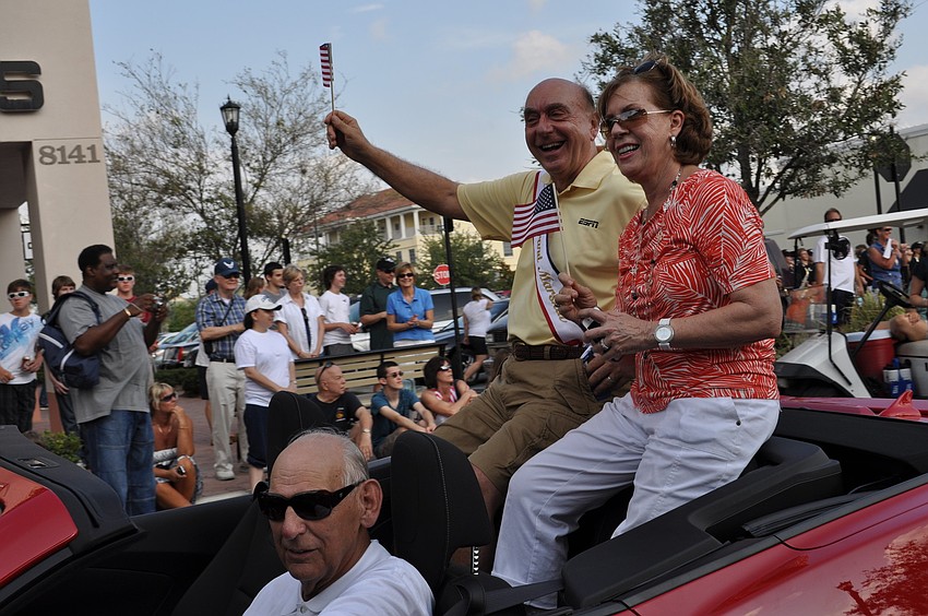 ESPN commentator Dick Vitale, with his wife Lorraine, served as the parade's grand marshal.