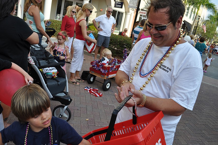 Lee Barnes, of Crowder Bros. ACE Hardware, passed out bottles of water.