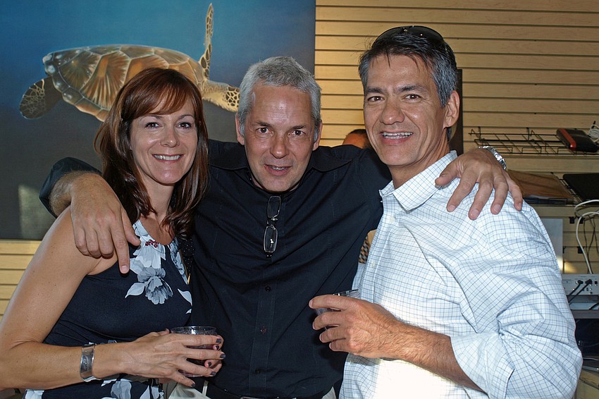 Artist and Owner of Let's Create Art, Clark Prosperi, center, made sure to greet guests Terri Lindsay, left, and Mark Lindsay, right.