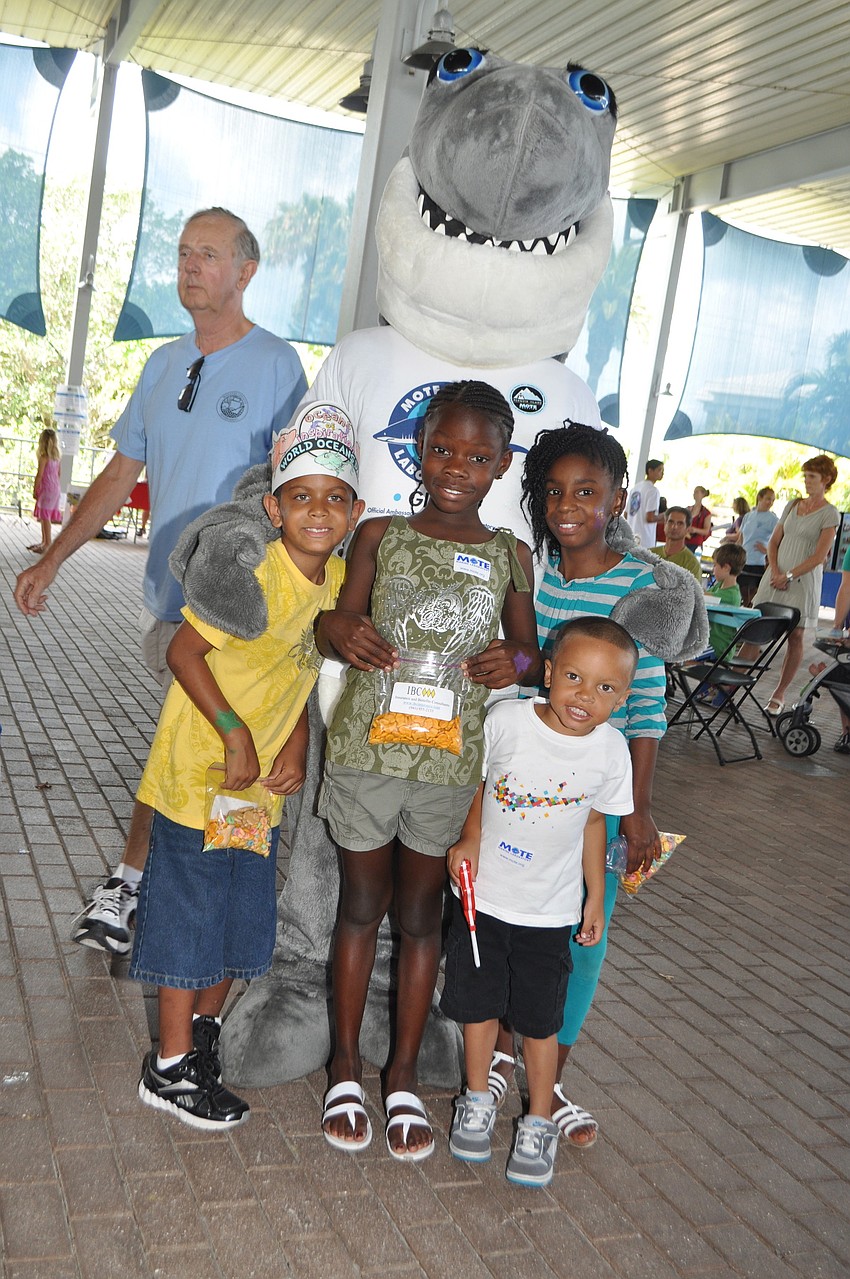 Jackson Tice, Janiyah Safford, Jaden Tice and Devondra Tice with Gilly the Shark