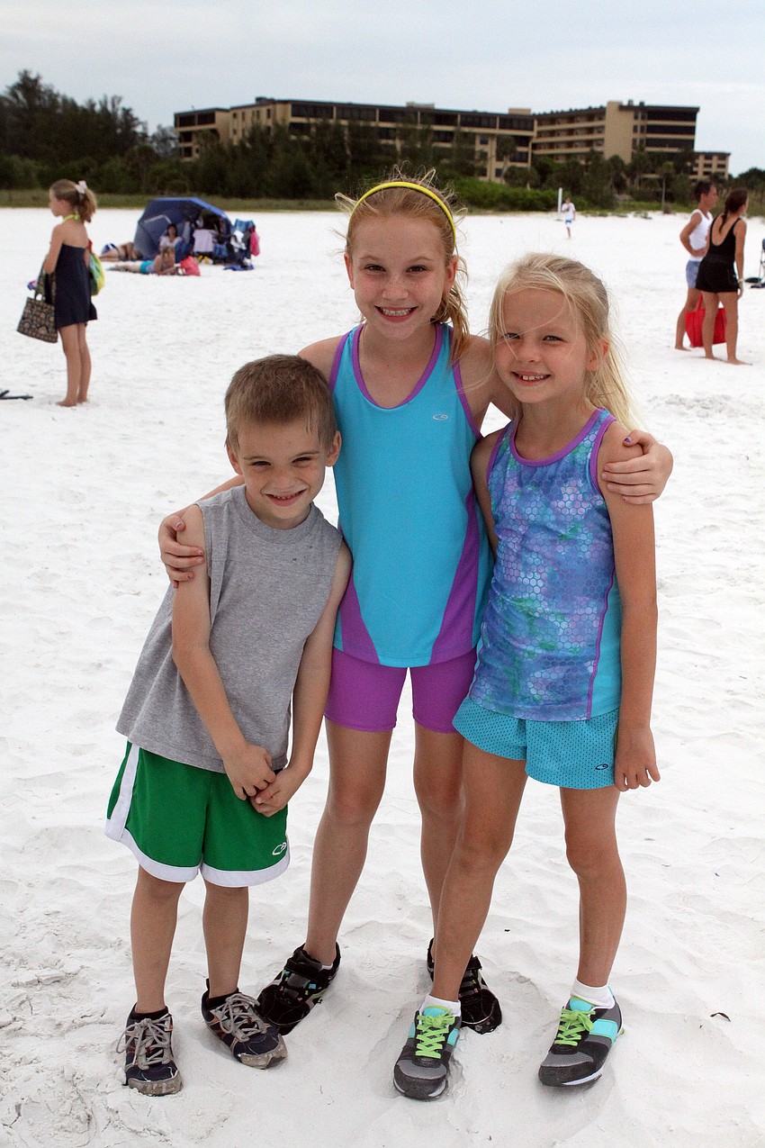 Ian Kemple, 5, with Izabella Rae, 10, and her sister, Jaeden, 8