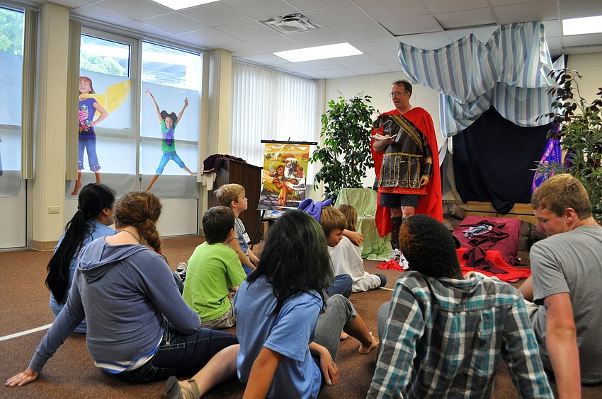 Students listen to a reading.