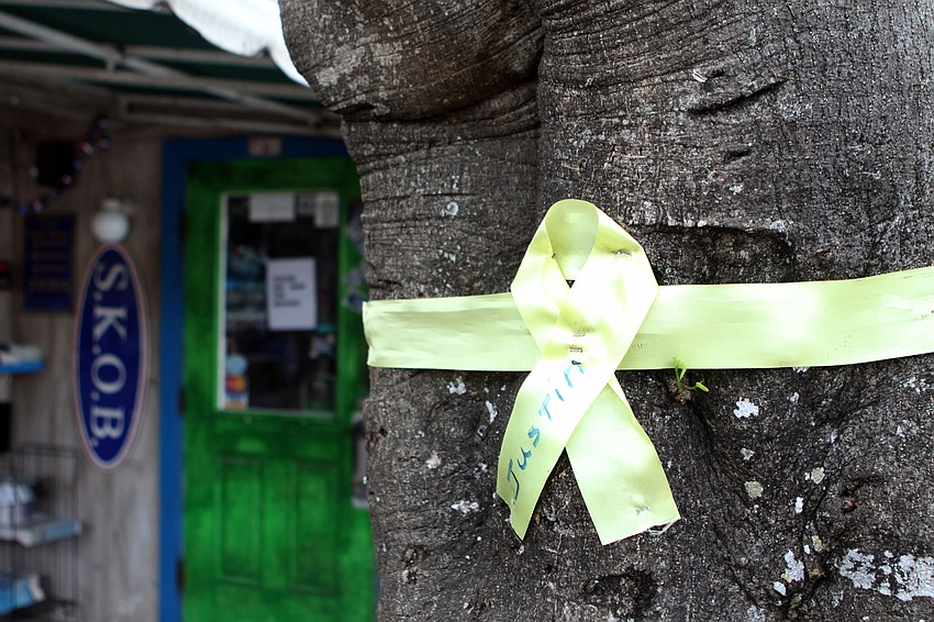 A yellow ribbon was around a tree at SKOB with Justin's name written on it, Wednesday, July 4. Beth Owen-Cipielewski's son, Justin Nash, is serving over in Afghanistan.