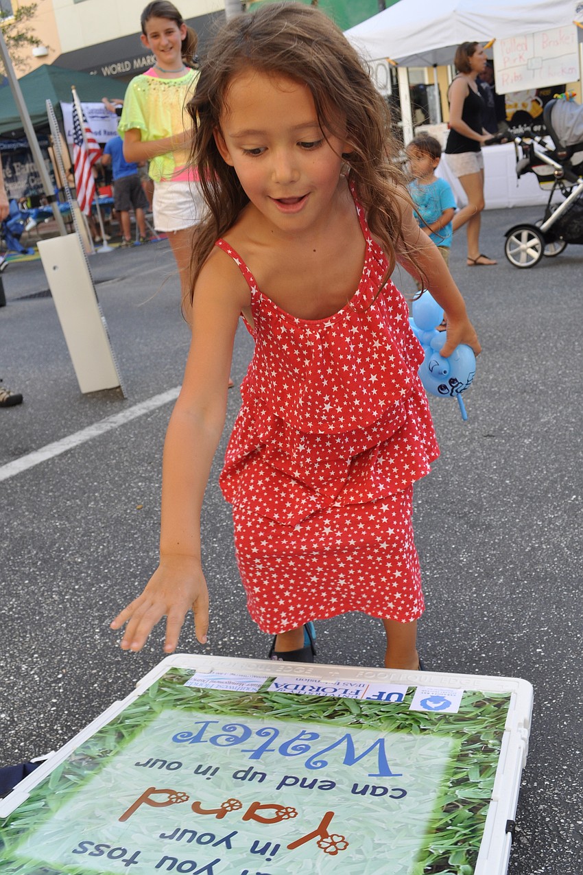 Lily Schlosberg, 4, tested her aim.