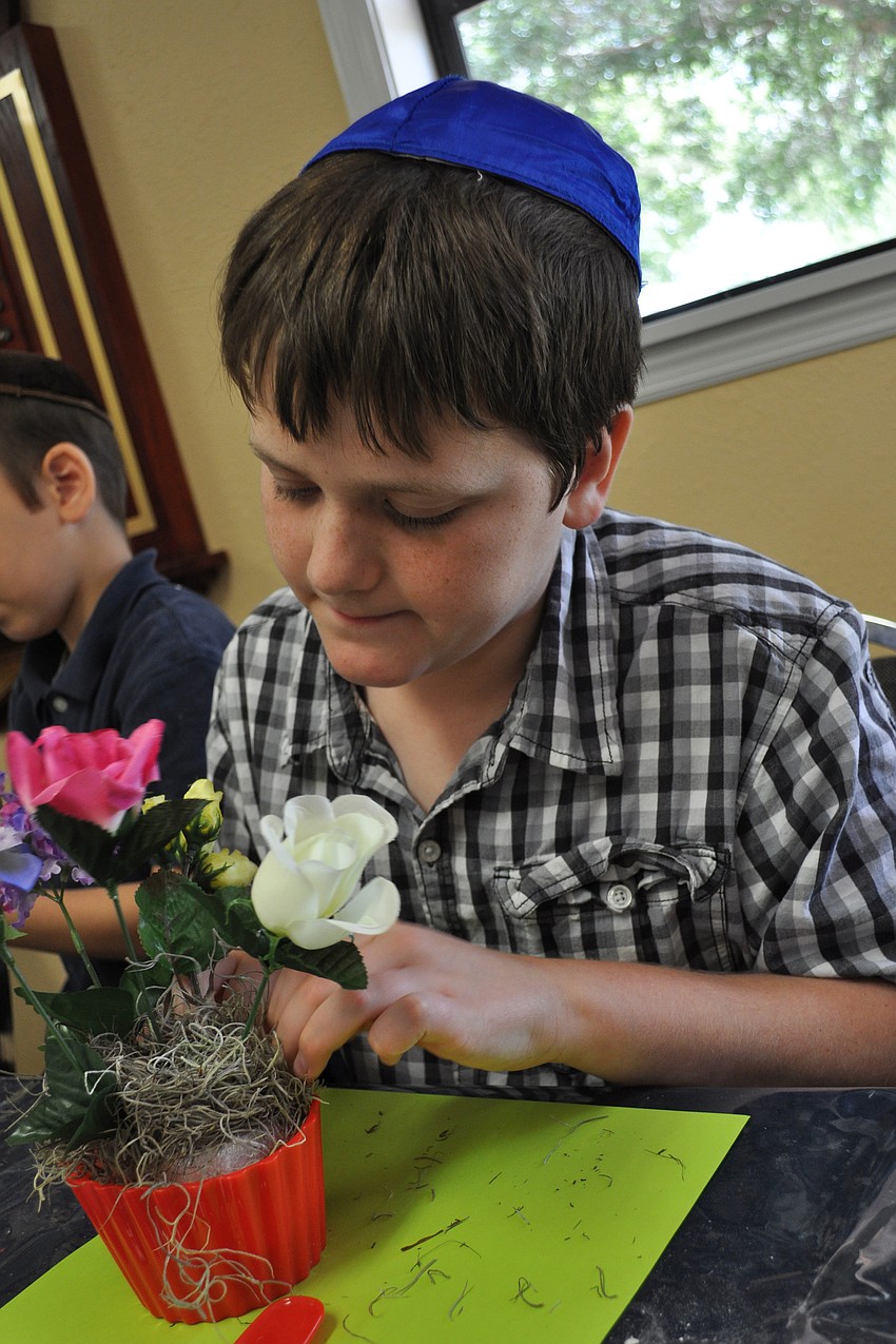 A.J. Benjamin carefully placed his flowers.
